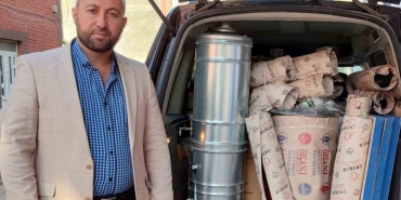 iste ornek imam yardimlariyla vatandasi isitiyor PK9P93J2.jpg